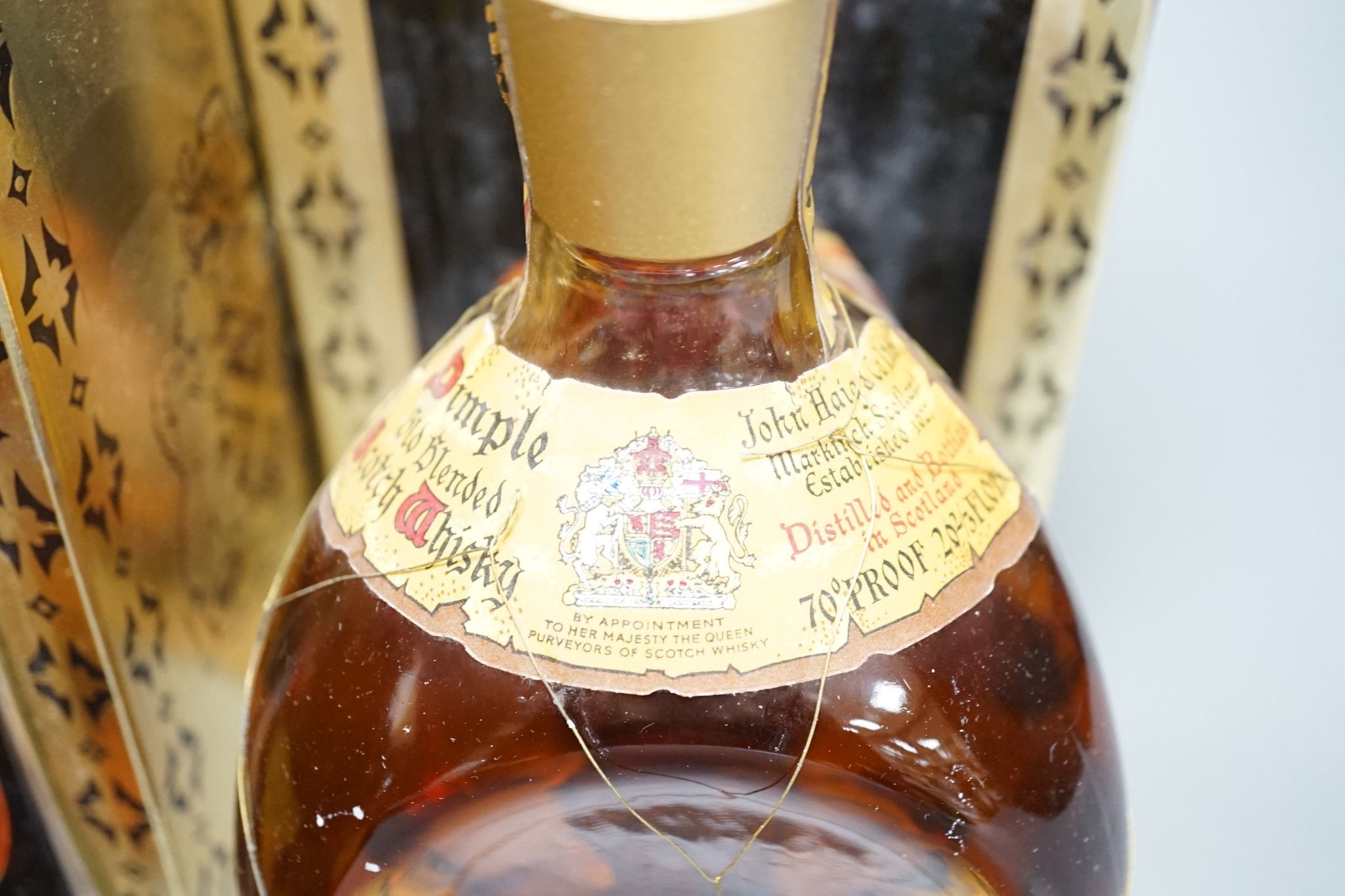 Two boxed bottles of Dimple Scotch whisky.